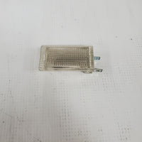 Genuine BMW E30 Courtesy light assembly. In trim panel above glove box